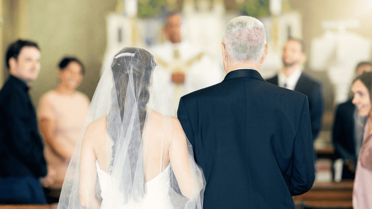 bride walked down church aisle by older man