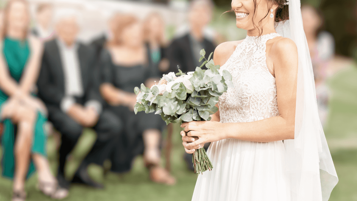 bride walking down aisle alone