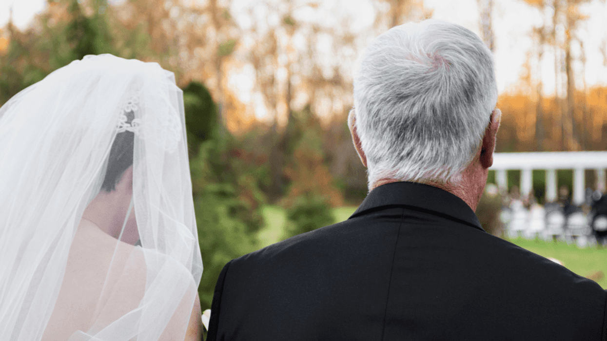Bride walking down the aisle with a family member