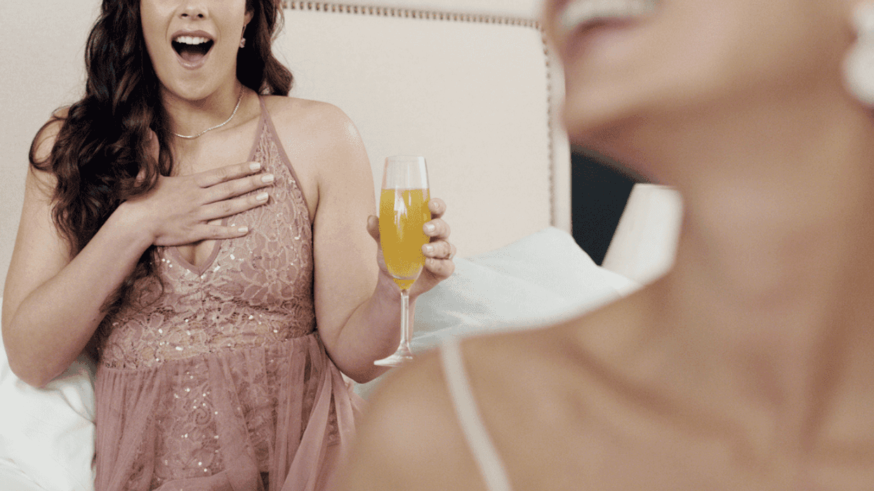 Bridesmaid admiring the bride