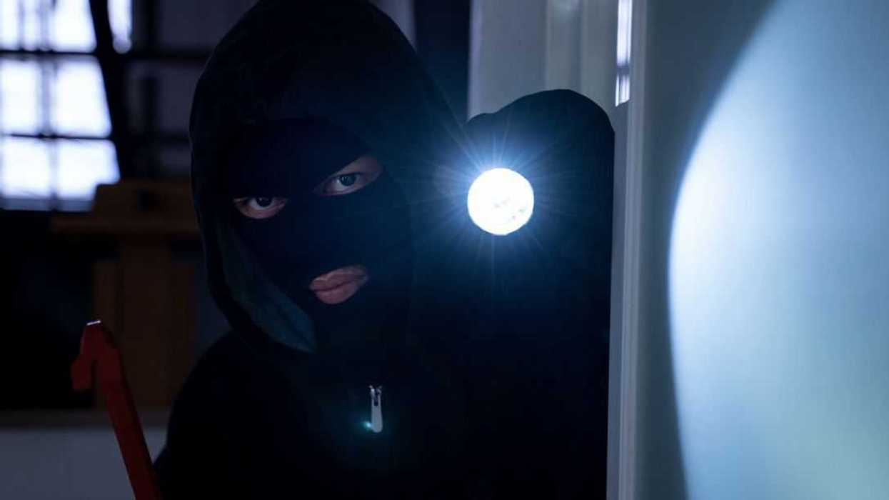 Burglar Breaking Into House.