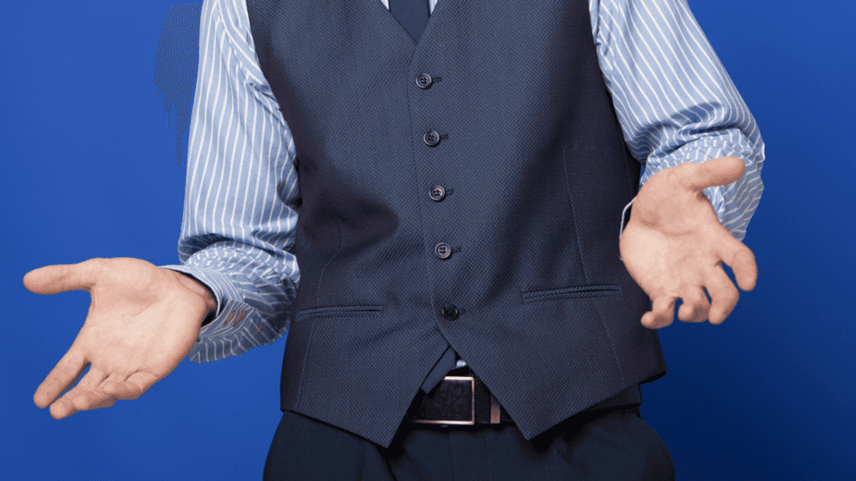 Business man shrugging his shoulders