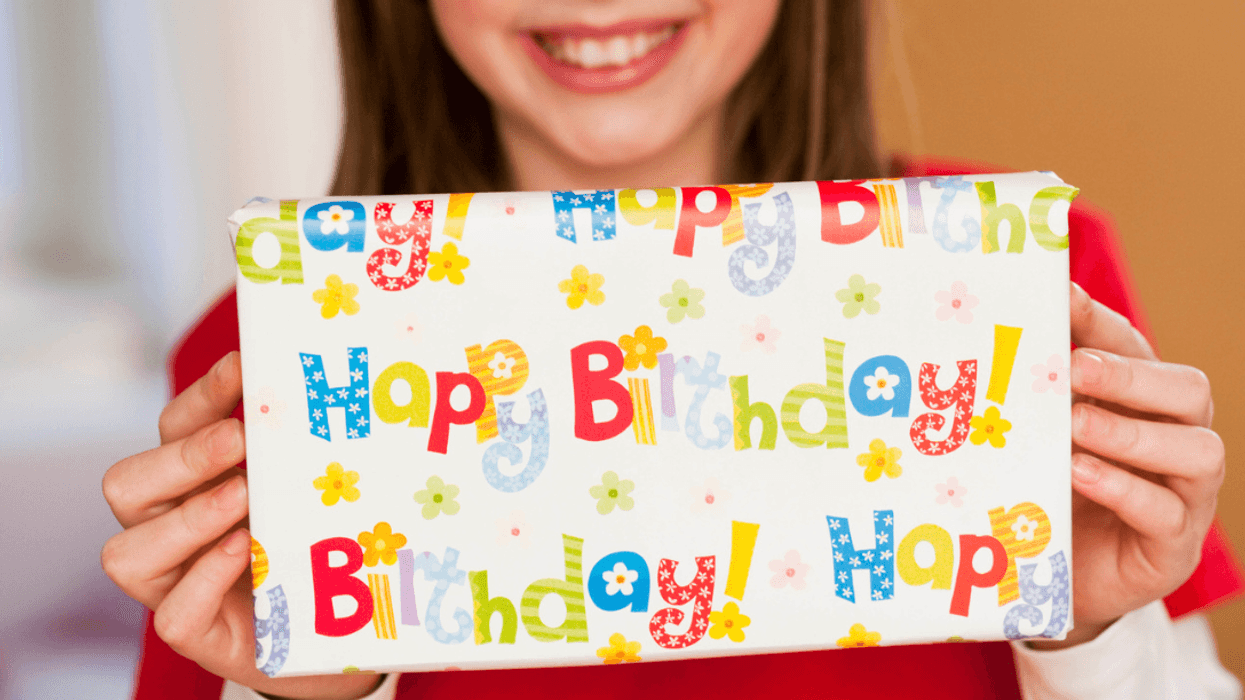 Child holding a birthday present