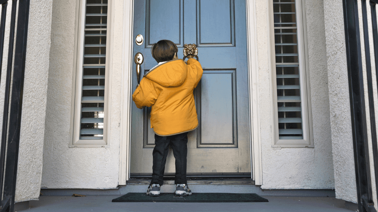 child knocking on neighbor's door
