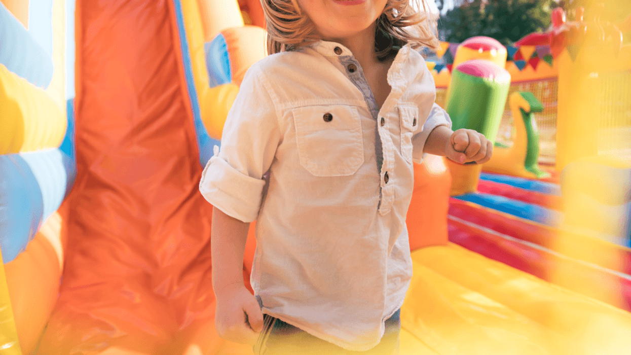 Child on a bouncy castle.