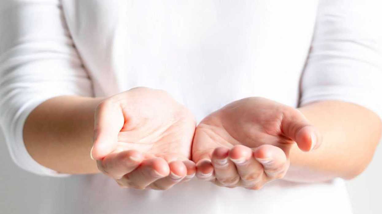 Close-up of a woman's open palms, two hands for prop up for something; or begging for something. selective focus inside palms.