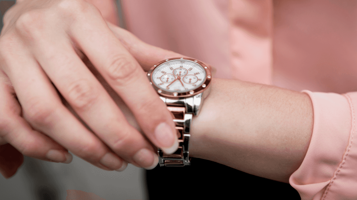 closeup of woman looking at watch