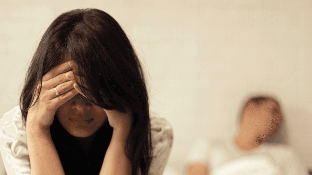 Couple arguing in bed