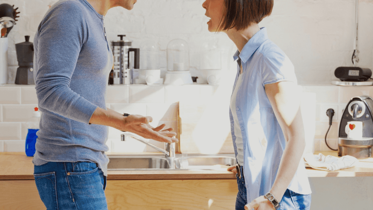 couple arguing in their kitchen