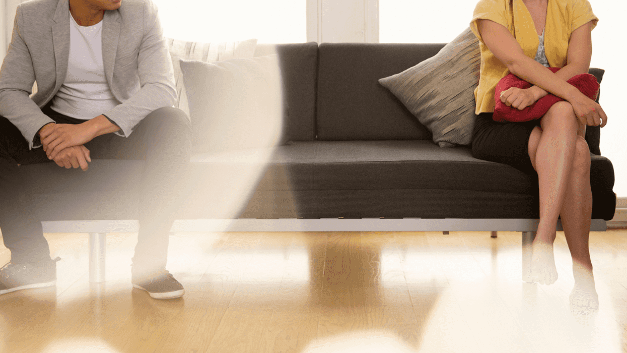 Couple arguing on couch