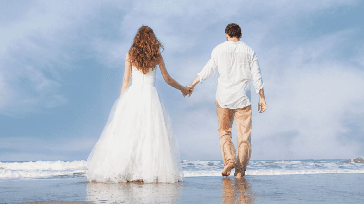 couple at destination wedding on beach