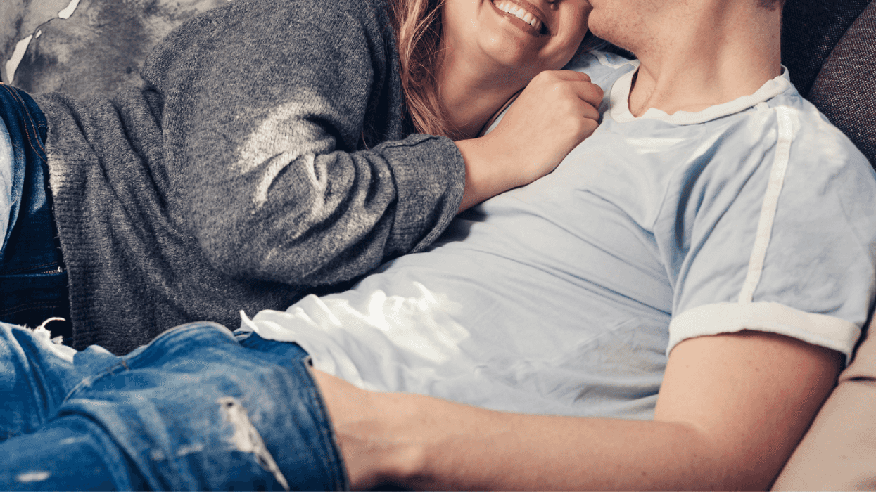 couple cuddling on couch