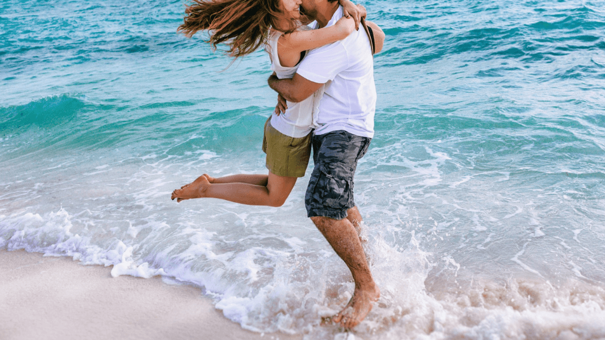 couple embrace on beach