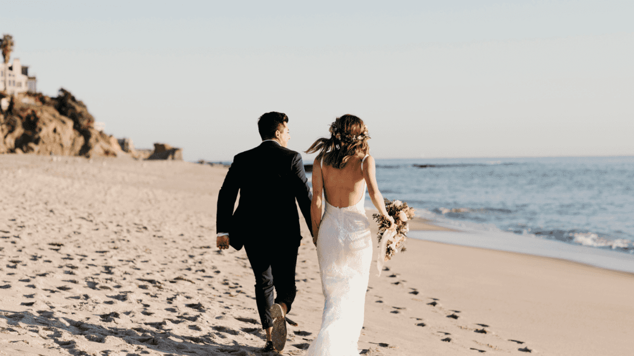 Couple getting married on the beach.