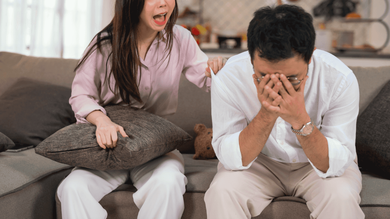Couple having an argument on the couch.