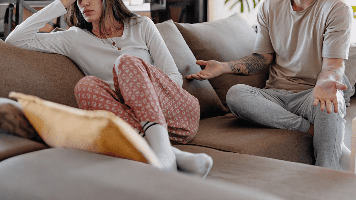 couple on sofa having disagreement