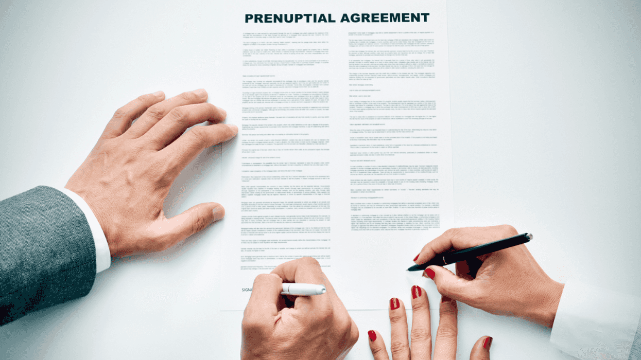 Couple signing a prenuptial agreement