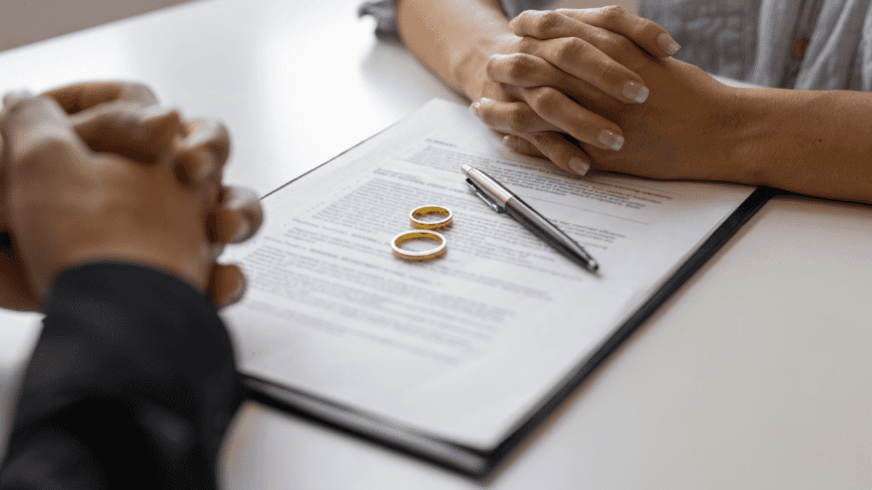 Couple signing divorce papers