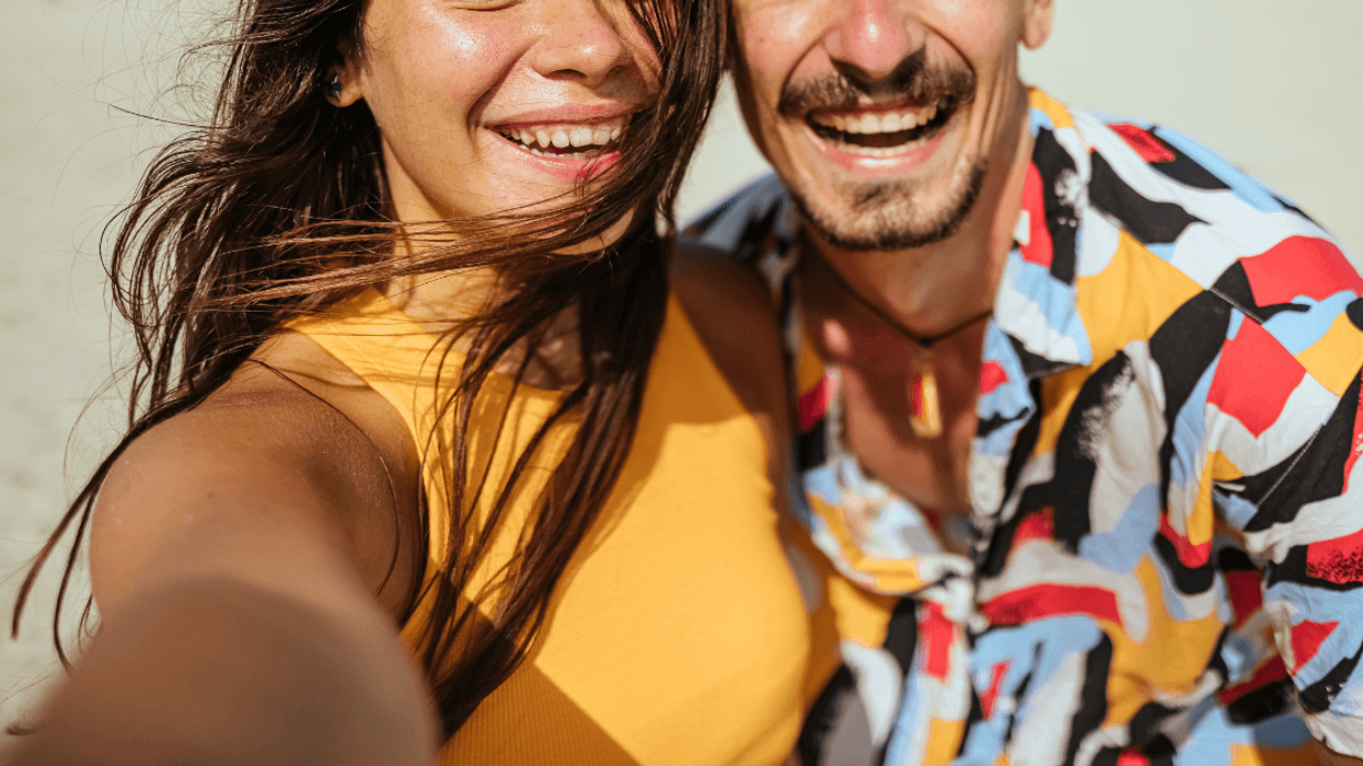 couple taking selfie on beach