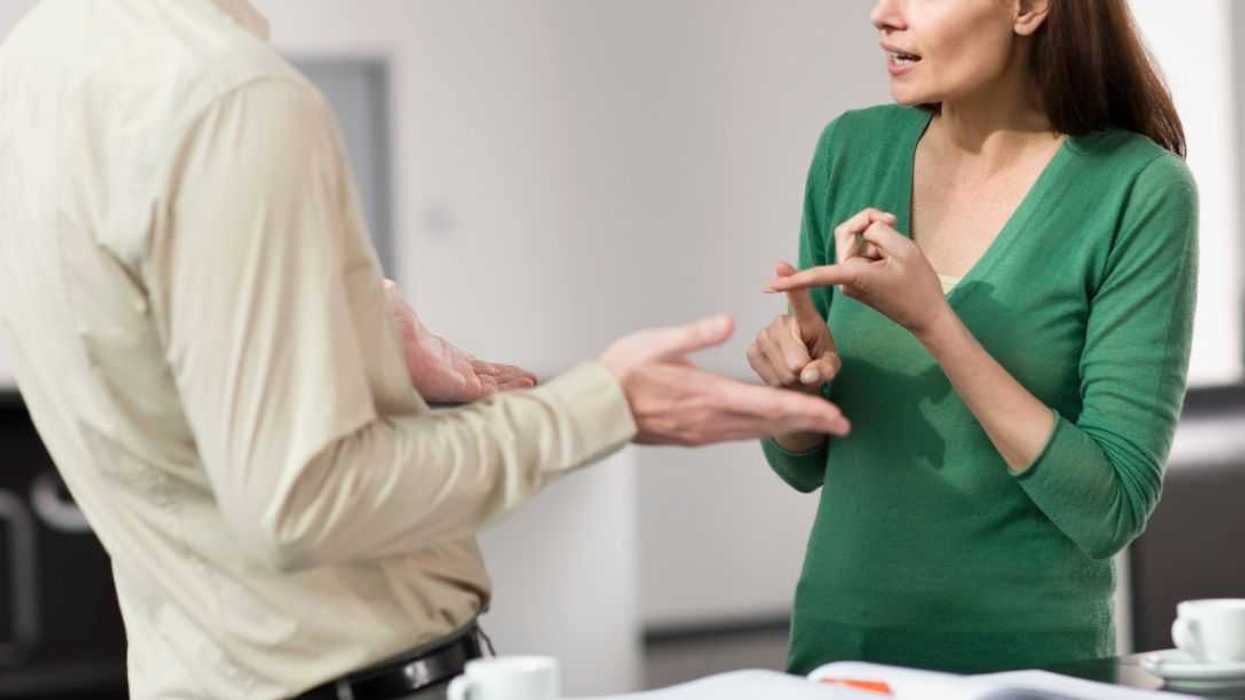 Cropped image of a male and female arguing at work.