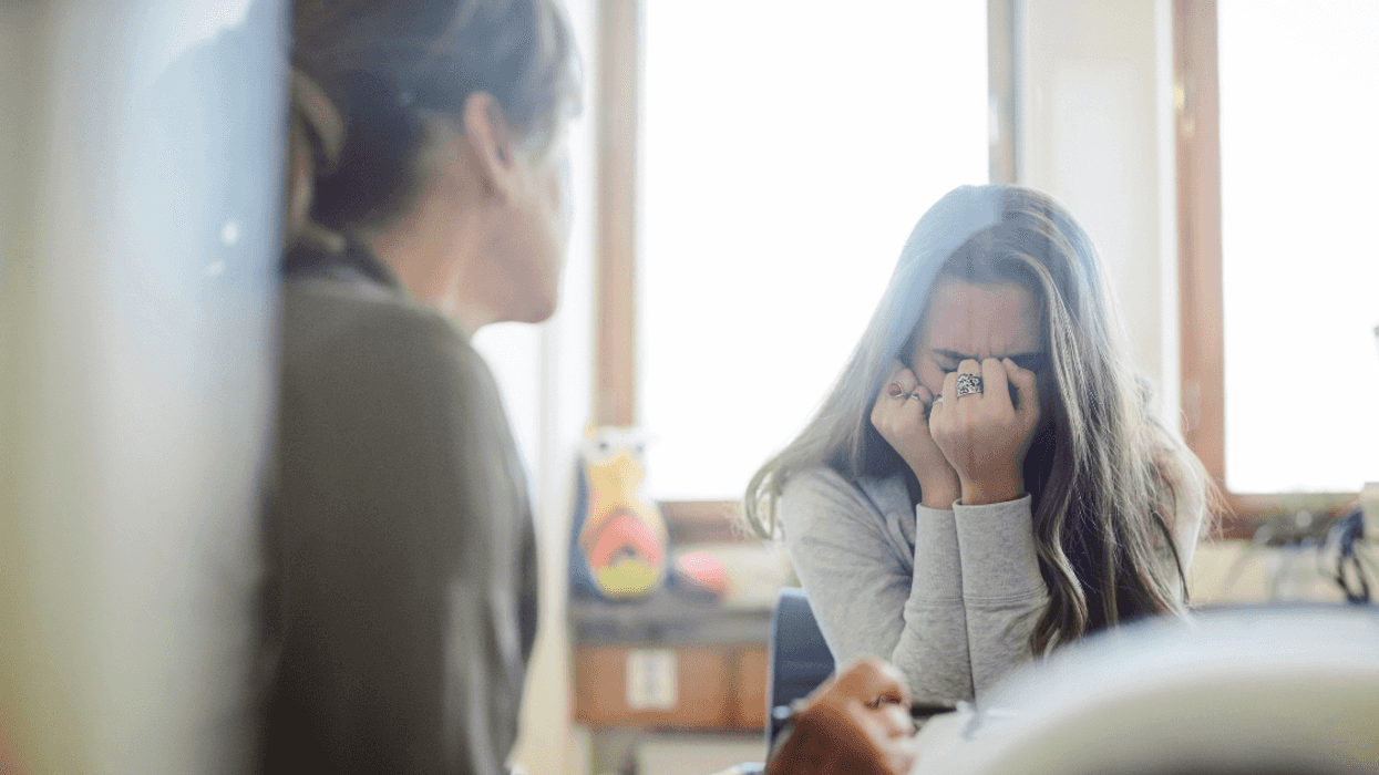 Crying teen girl with mother
