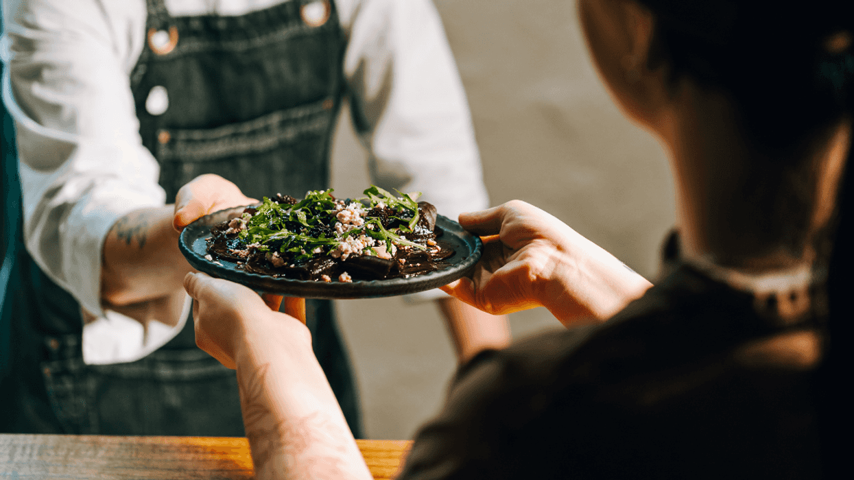 customer is served food in restaurant
