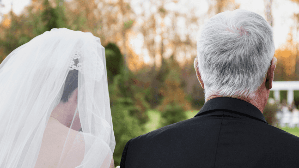 Dad walking his daughter down the aisle