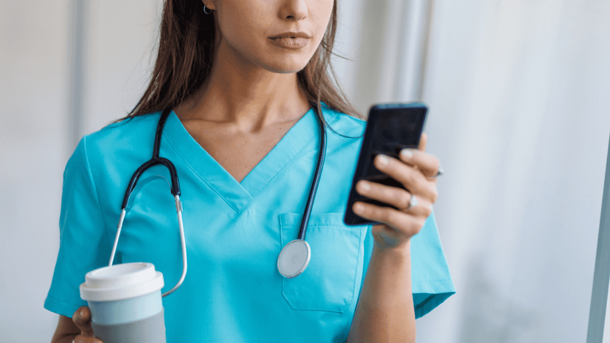 Doctor looking at her phone