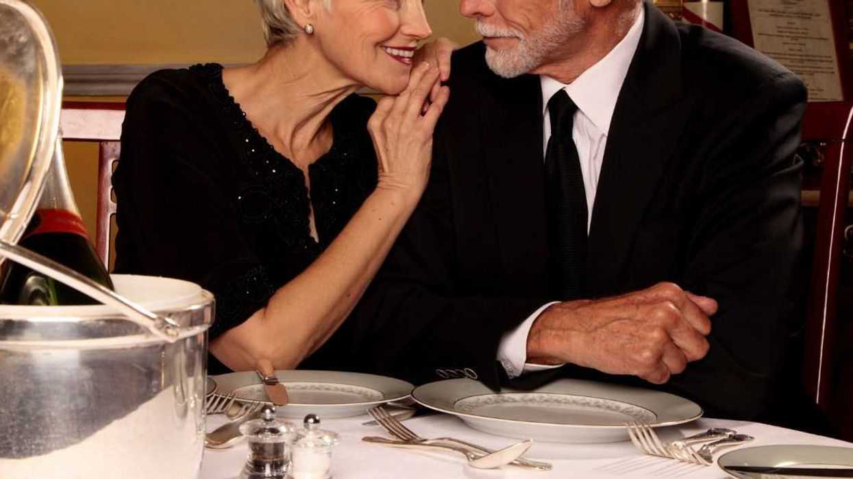 Elderly couple looking at each other