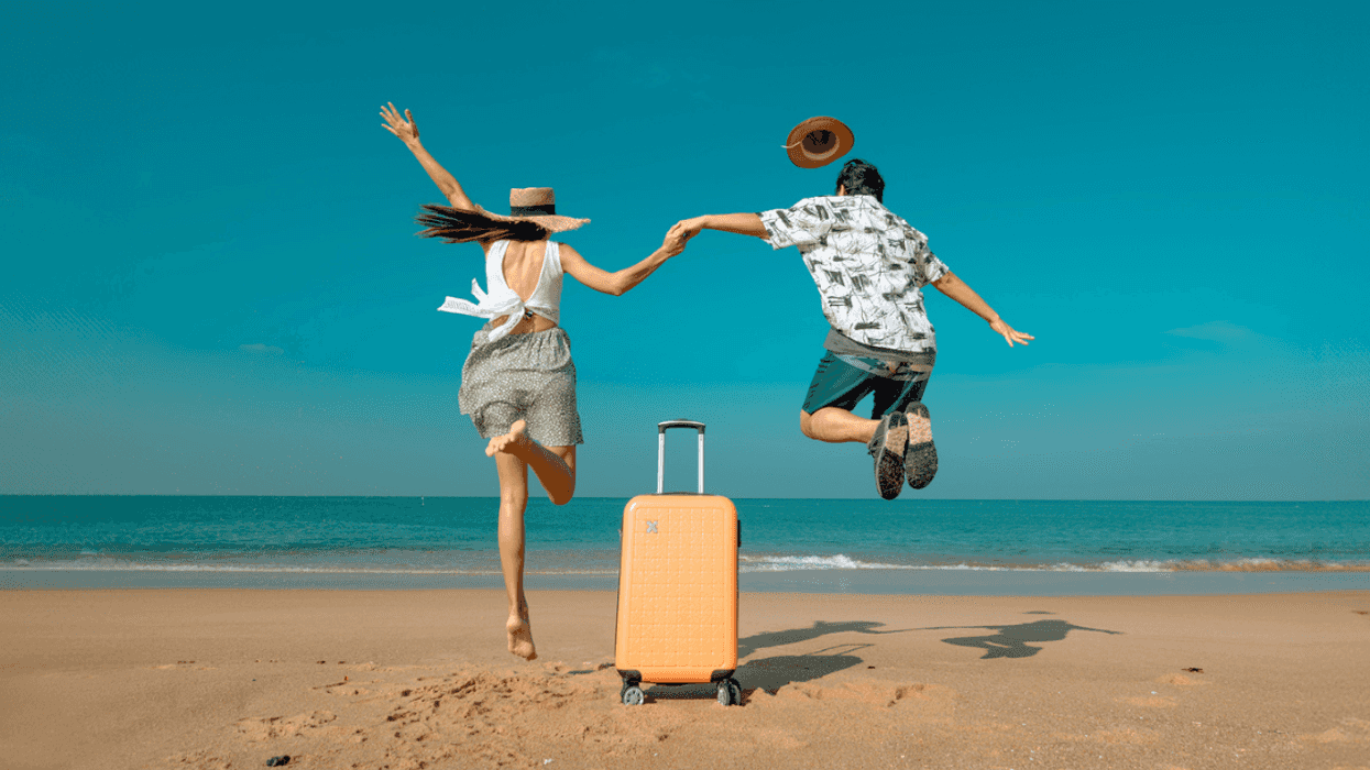 Excited couple on the beach