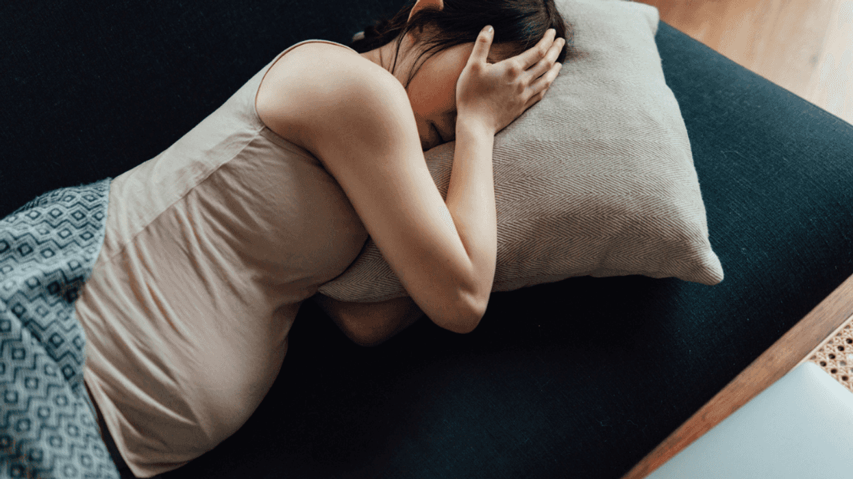 Exhausted pregnant woman who cannot sleep