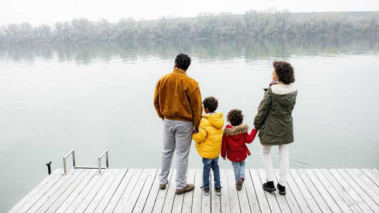 Family overlooking a lake