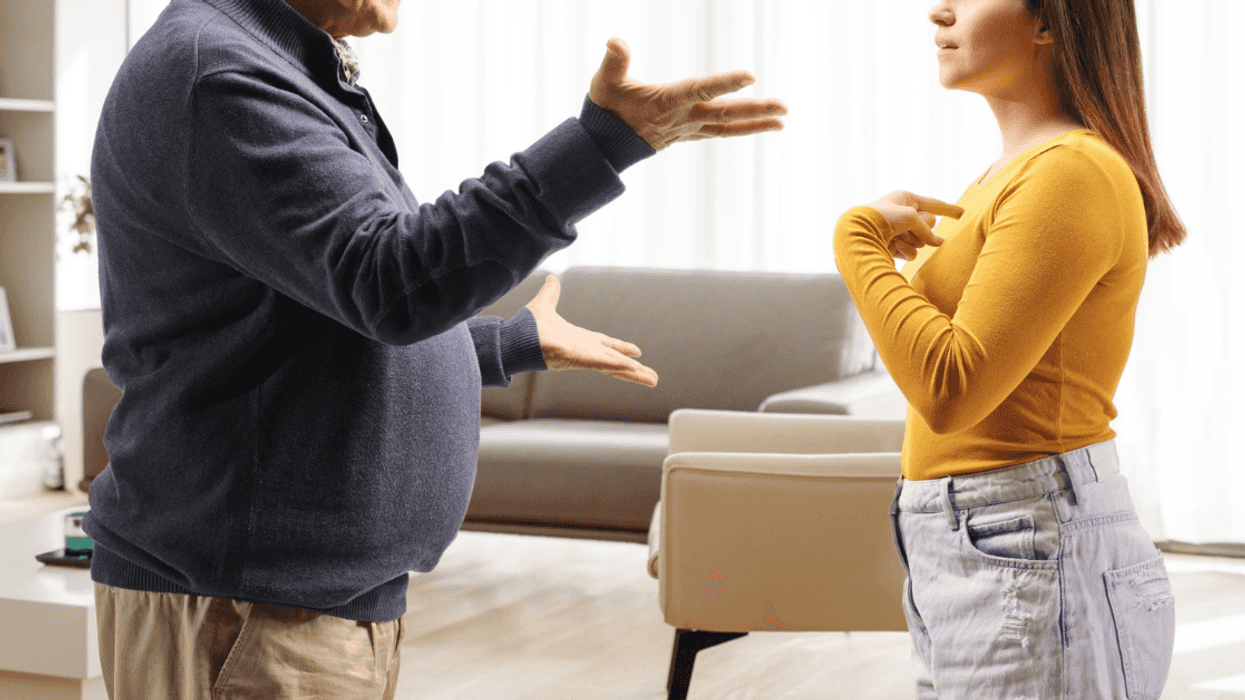 father and daughter arguing in living room