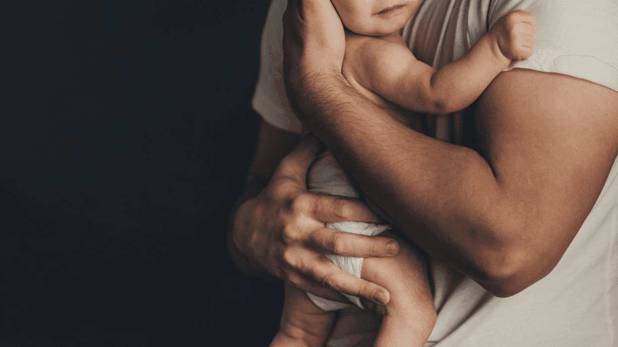 Father holding baby.