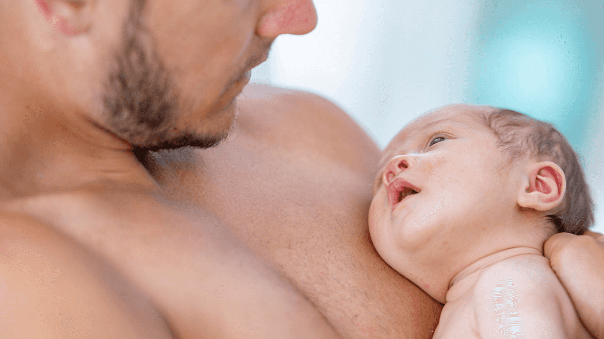 Father holding his baby skin-to-skin
