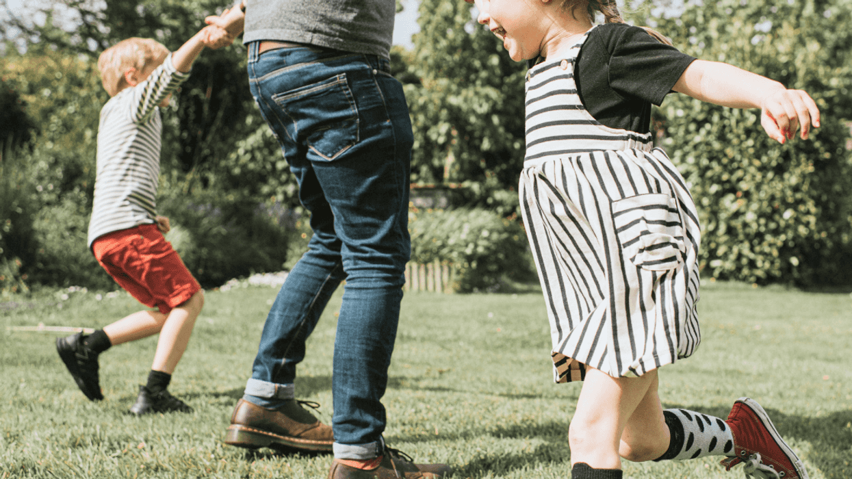 father playing with his two children