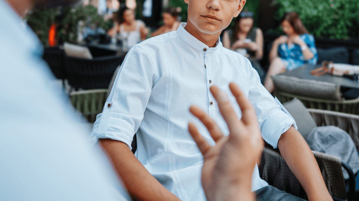 father speaks to his angry teenage son