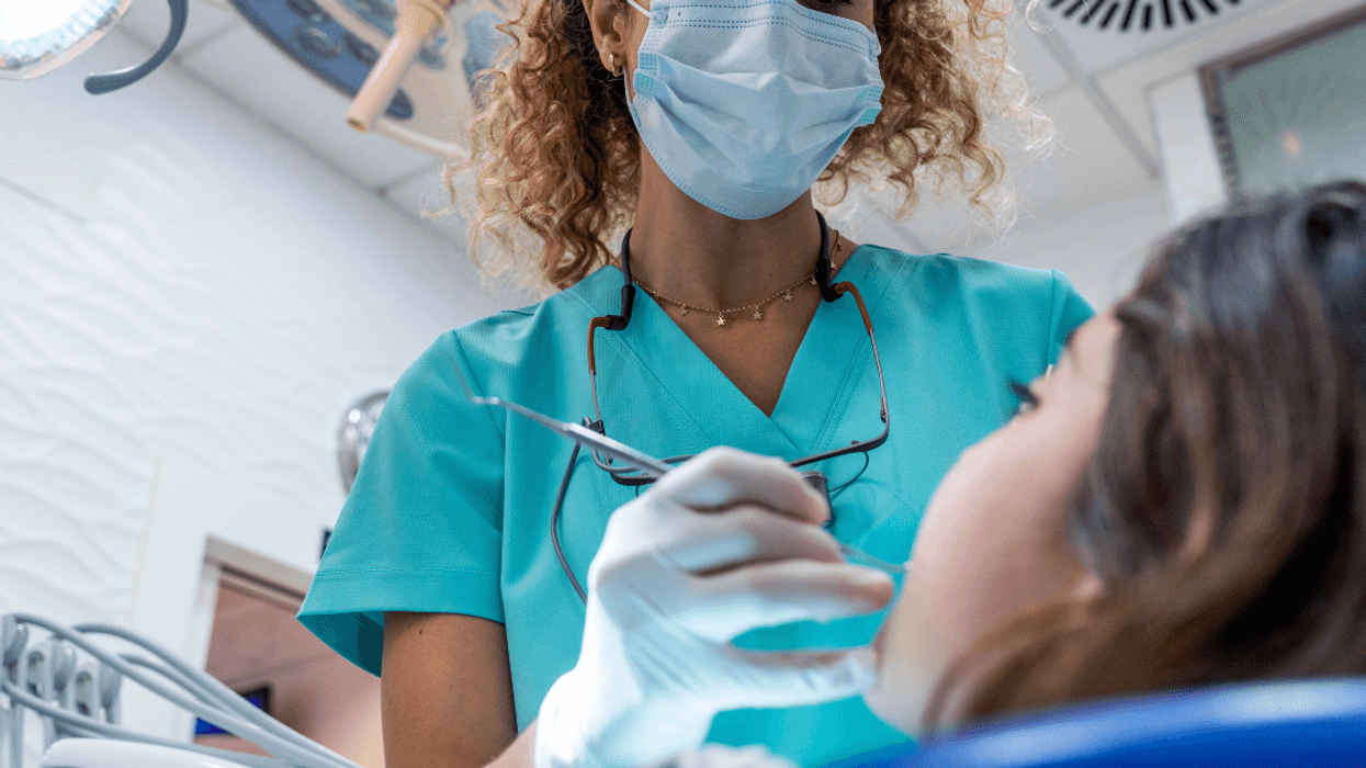 Female dentist with patient