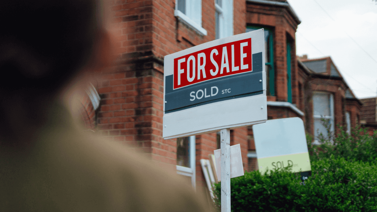 for sale sold sign in front of home