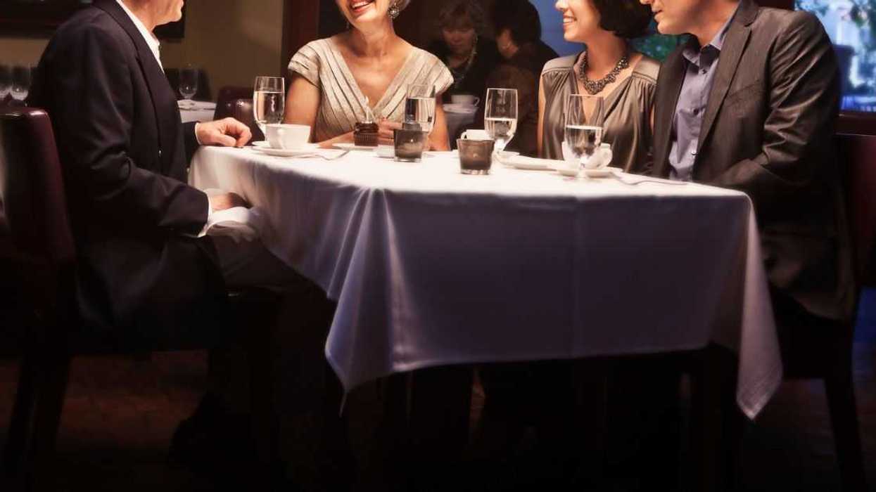 Four people eating at a restaurant