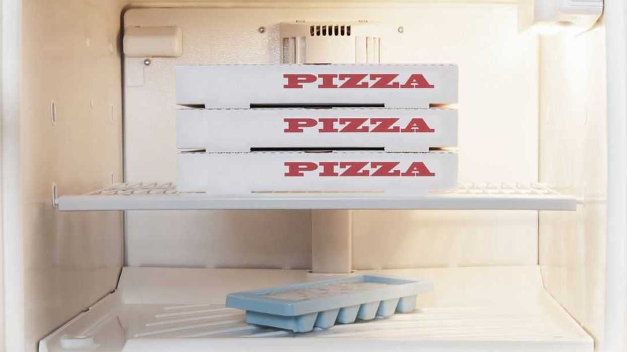 Frozen Pizzas inside Home Freezer