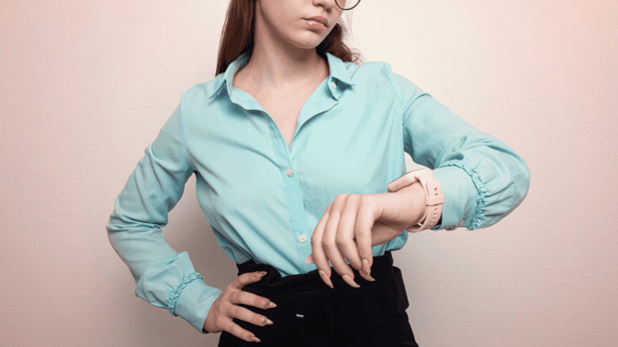 Frustrated woman checking the time