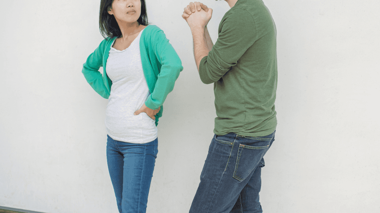 Frustrated woman looking at man pleading