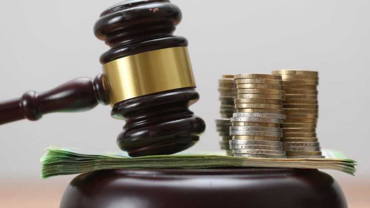 Gavel on Euro Background – Corruption, Fraud, Auctions, Fines, and Crime.