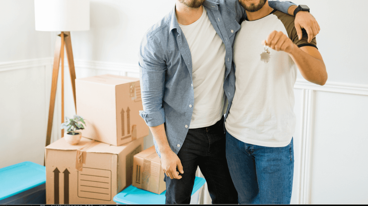 Gay couple with a house key.