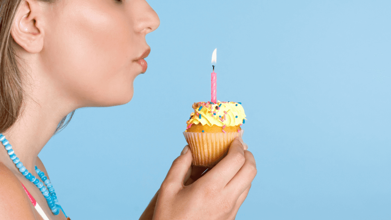 Girl blowing out her birthday candles