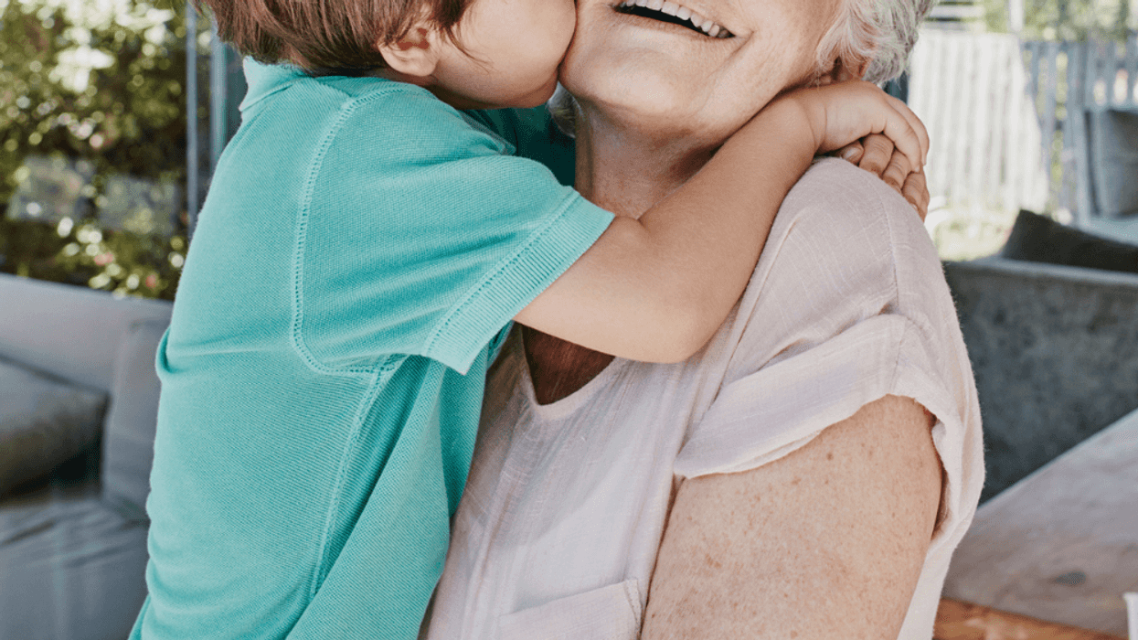 Grandmother embraces grandson