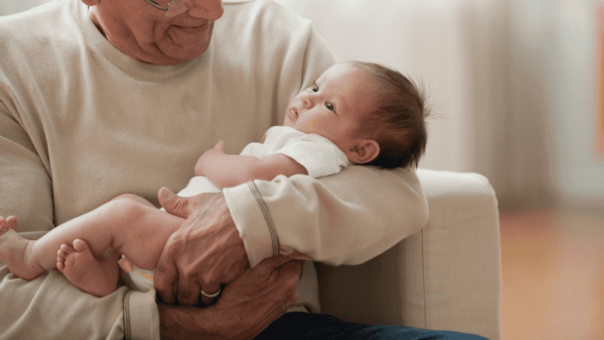 Grandpa holding baby