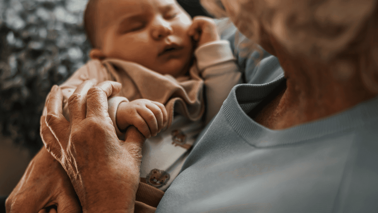 Grandparent holding their grandchild