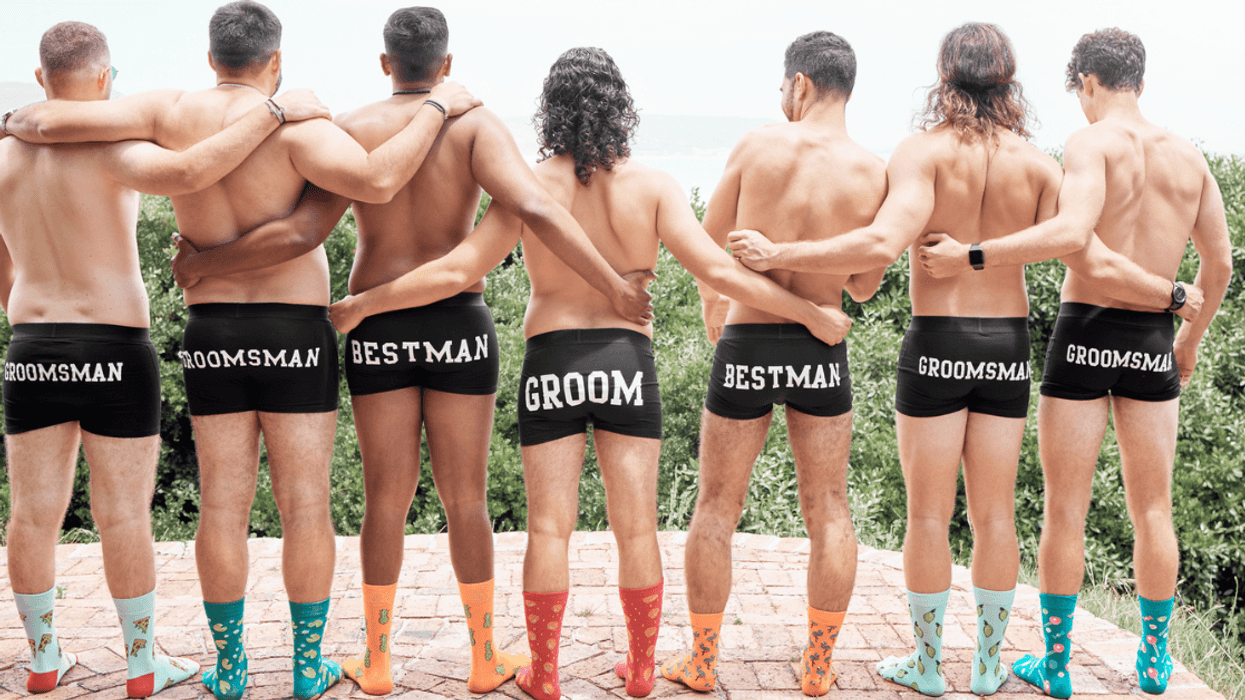 groom and his wedding party pose in briefs and socks